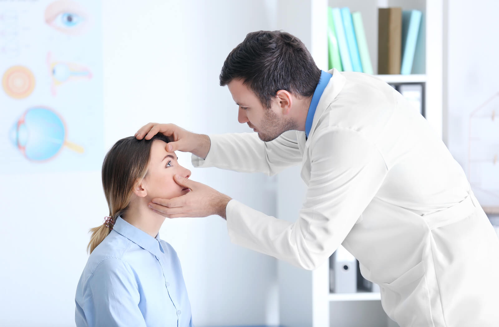 an optometrist examines a woman's eyes due to eye infection