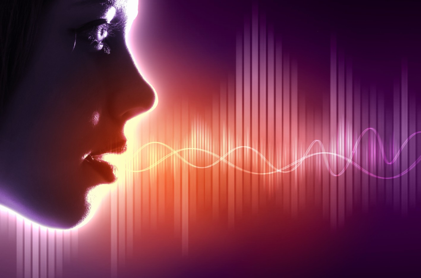 A futuristic image showing a profile of a persons face with sound waves coming out of the mouth.
