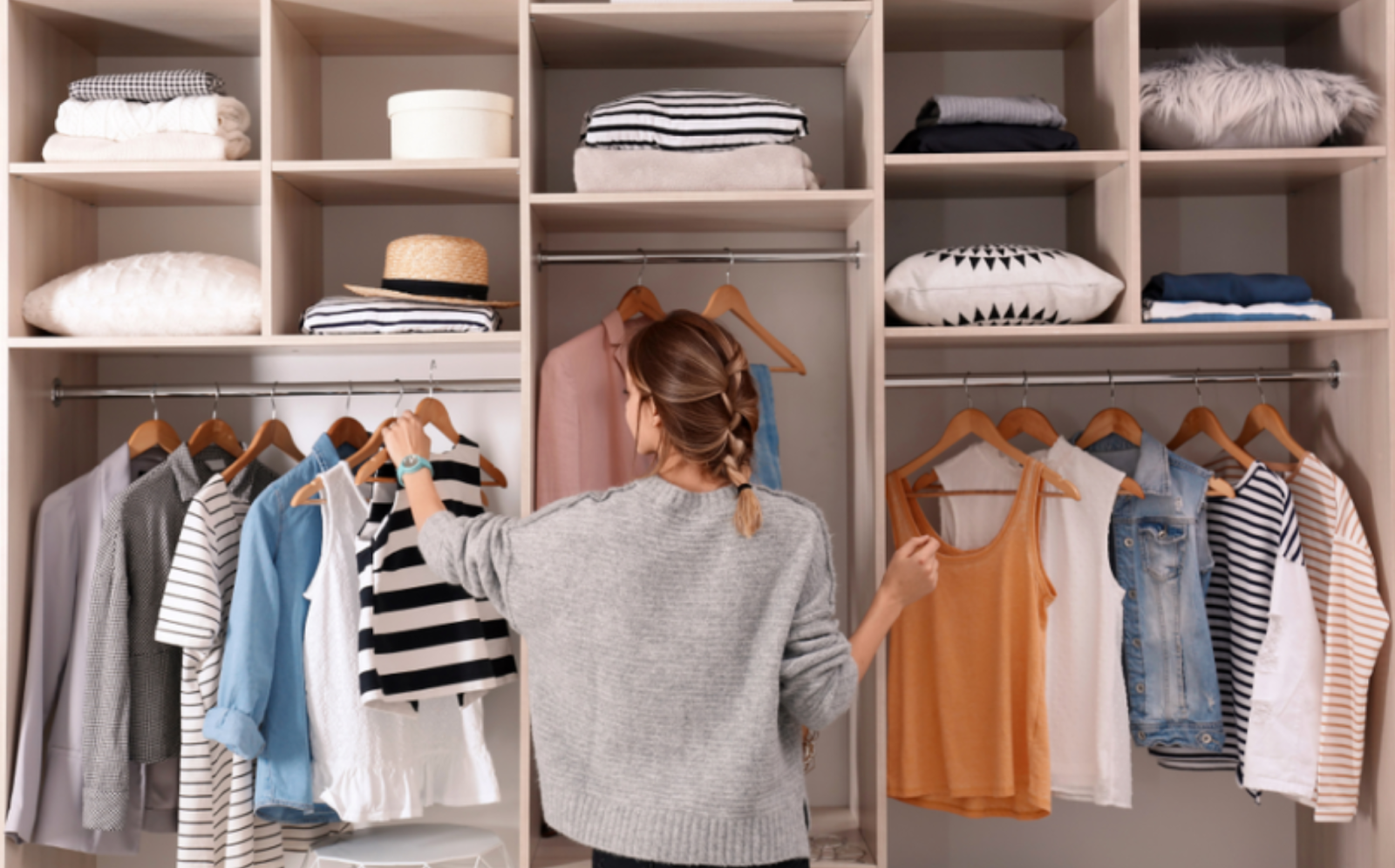 photo of woman standing in front of her closet