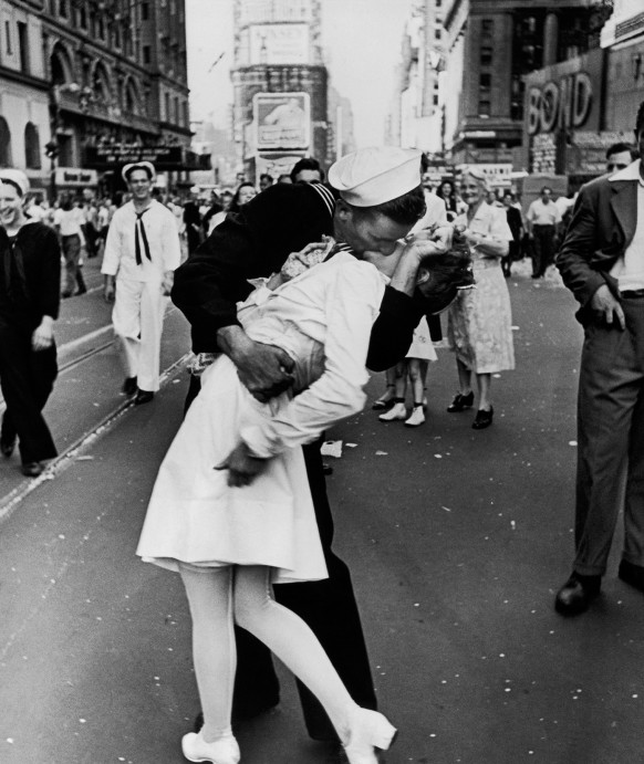 An American sailor kisses a nurse among the crowd in Times Square celebrating V Day, the long-awaited victory over Japan in WWII, on August 14, 1945.