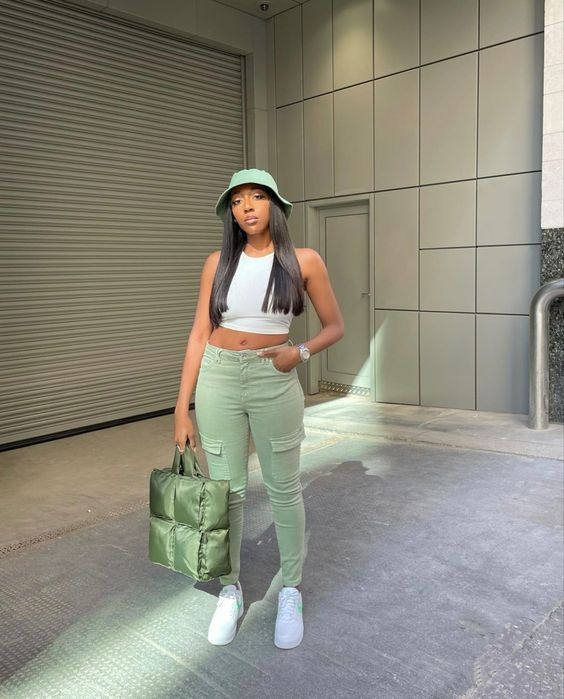 pretty lady wearing bucket hat with tank top and pants