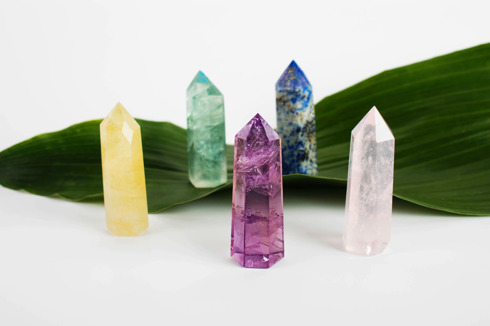 Five quartz crystal towers in different colours.
