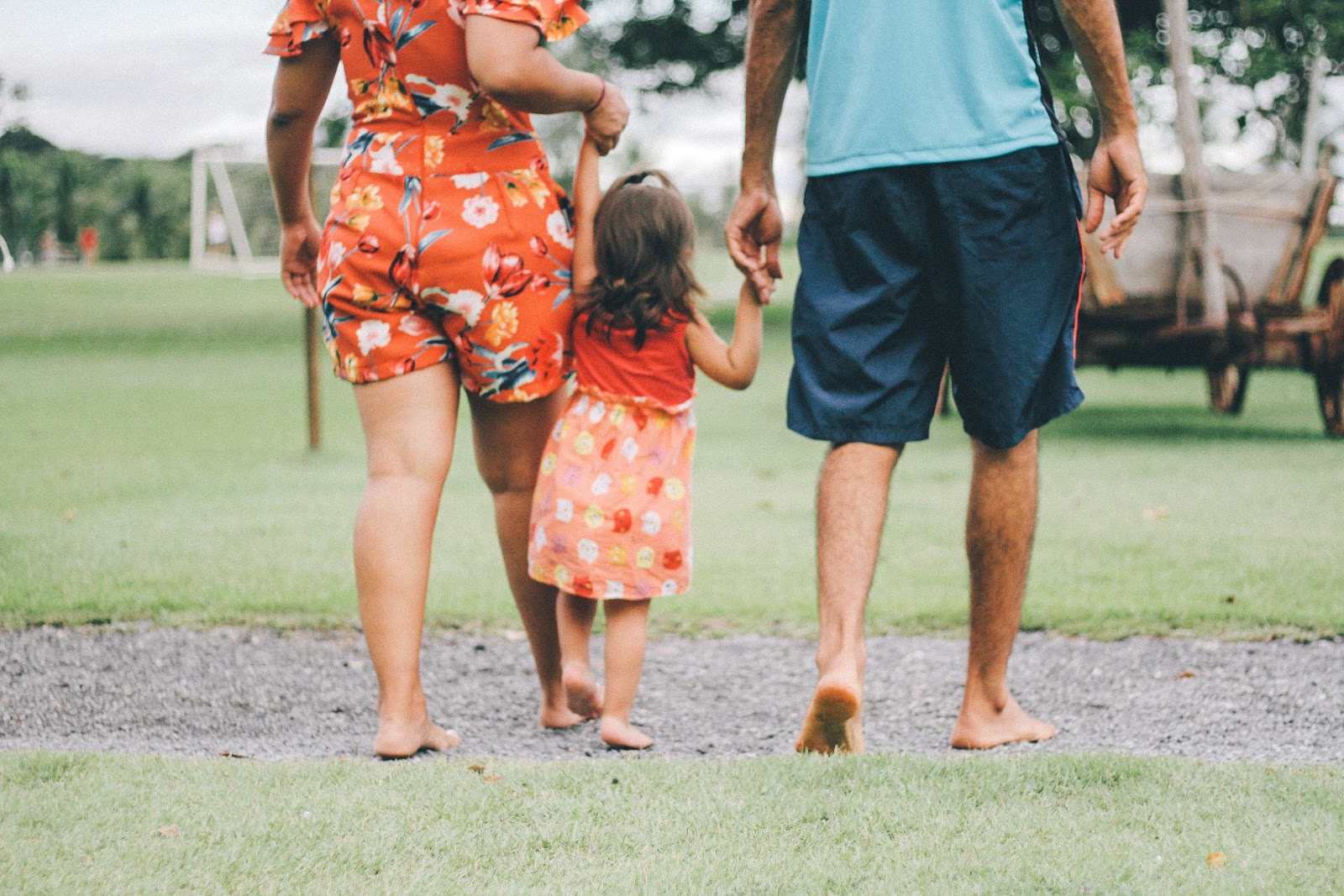 making a career change family of three husband wife child walking