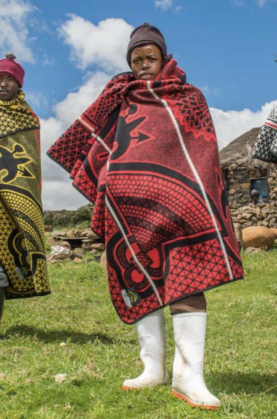 men in the field wearing Sotho traditional attires