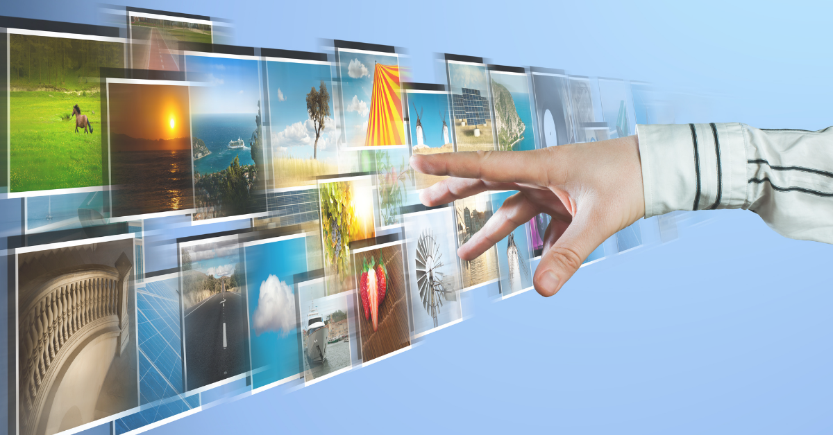 A hand grabbing multiple stock images