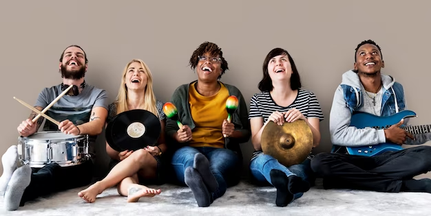 A group of people with musical instruments in their hands who are smiling