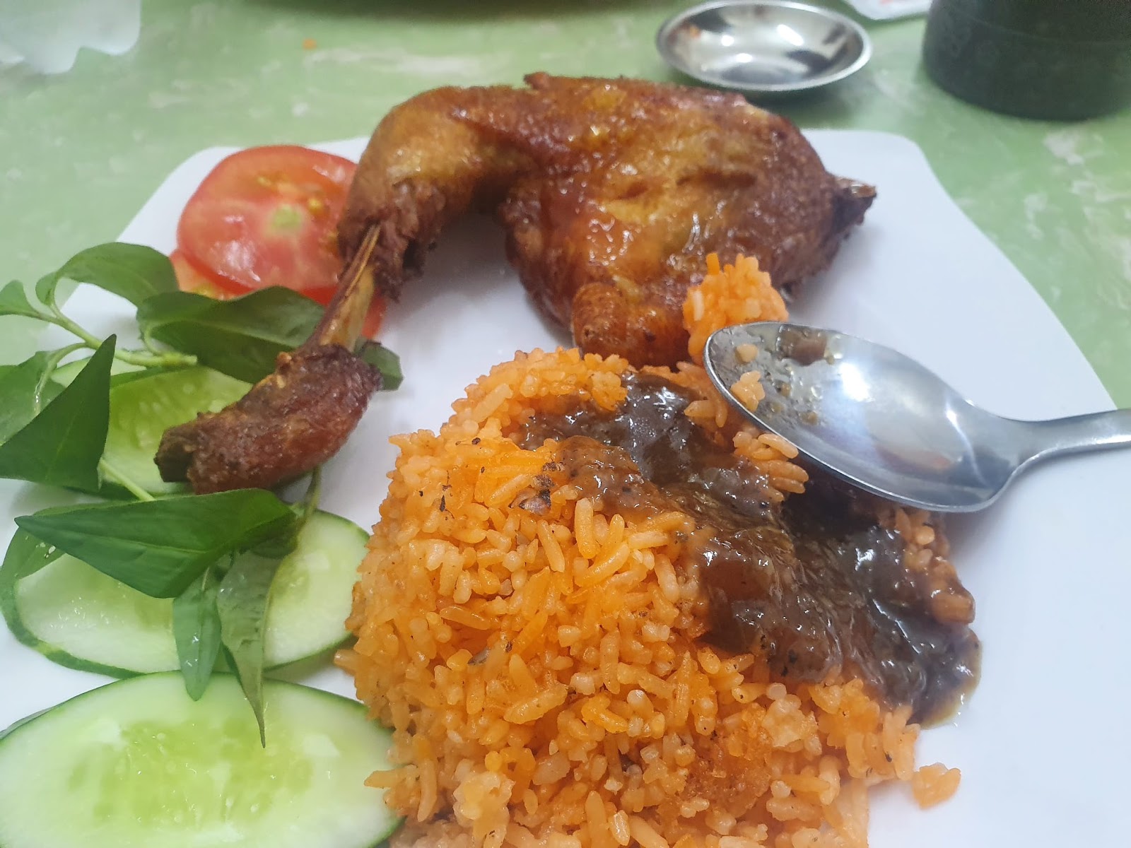 Cơm Gà Xối Mỡ Su Su orange fried rice close up with pepper sauce