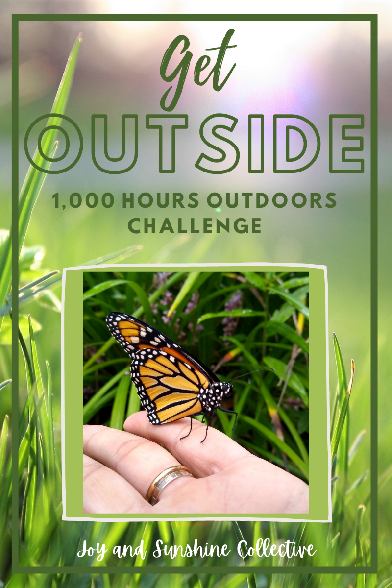 1,000 hours outside: 1,000 hours outdoors challenge image of hand holding butterfly with grass in background.