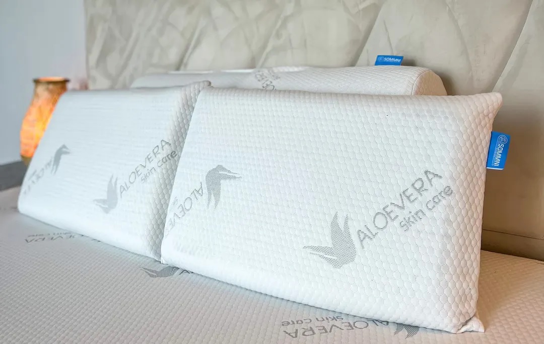 Soft 100% natural latex pillow with pinhole design, encased in aloe vera skin care fabric