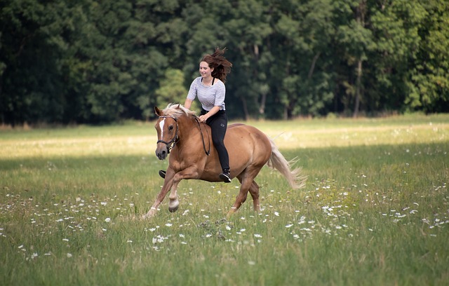 a woman horseback riding