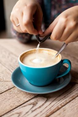 C:\Users\Кристина\Downloads\close-up-female-hand-pours-sugar-into-coffee-wooden-surface.jpg