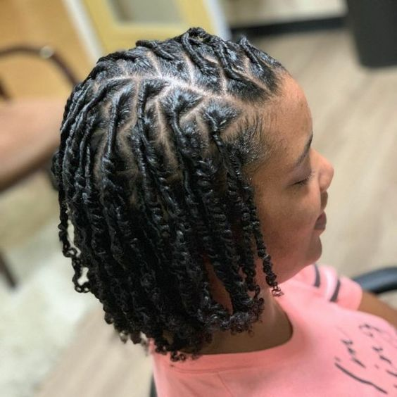 Full picture of a woman wearing starter locs