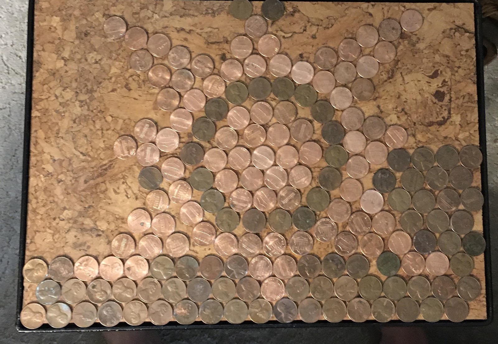 yard sale metal table with pennies