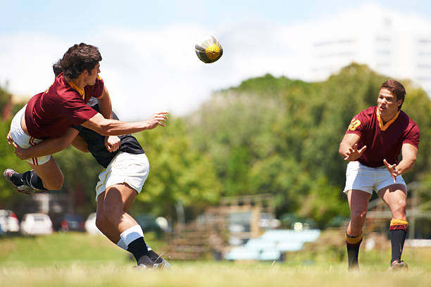 A perfect spiral pass between two players
