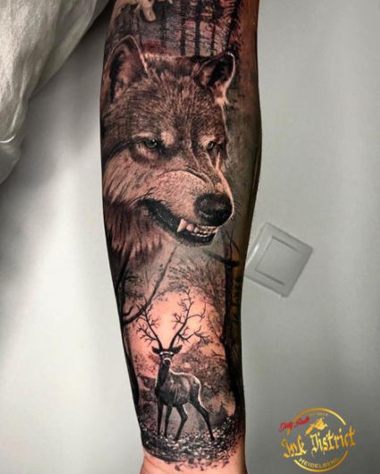 Alpha Wolf And Deer Tattoo Design On Arm