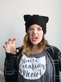 woman wearing a black cat crochet hat