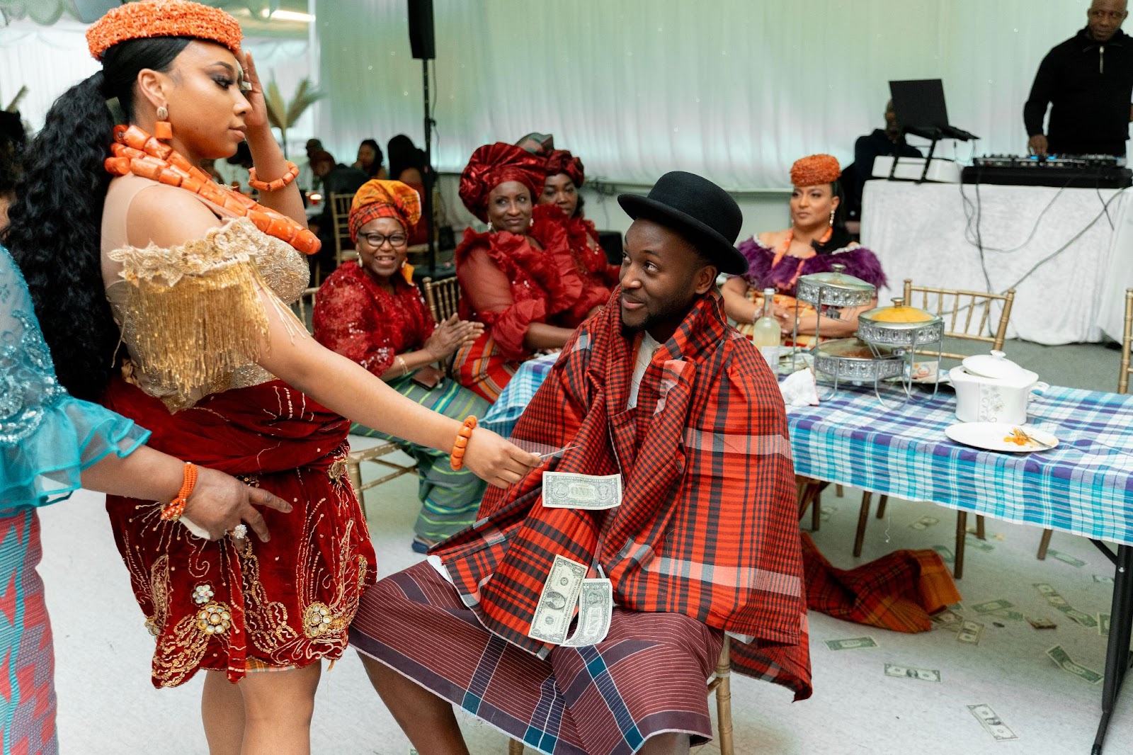 Bride placing money onto groom as a traditional cultural wedding custom