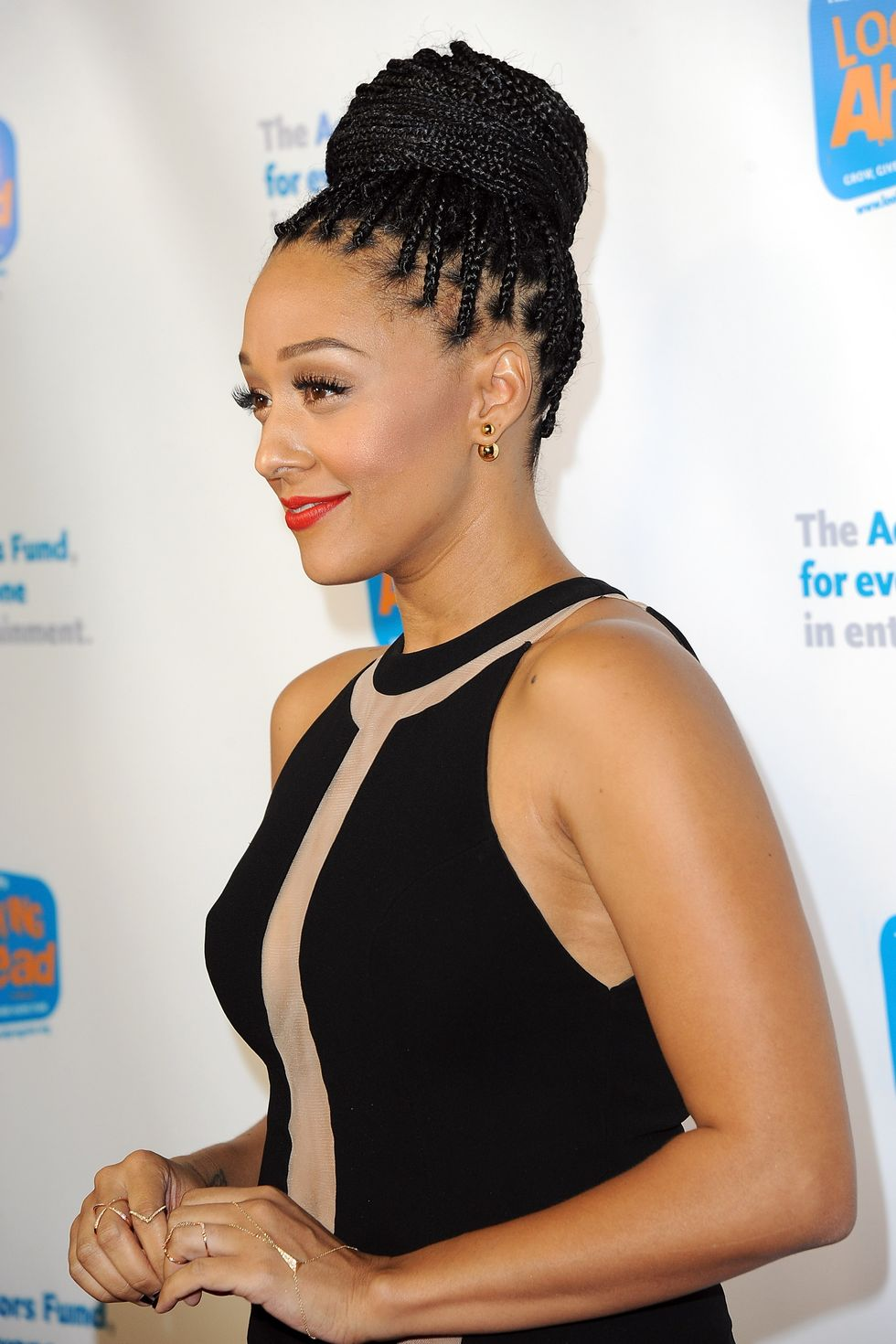 Get an elegant look with top knot bun with braids