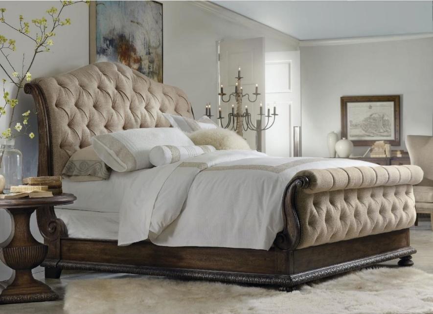 a luxurious bedroom with a sleigh bed
