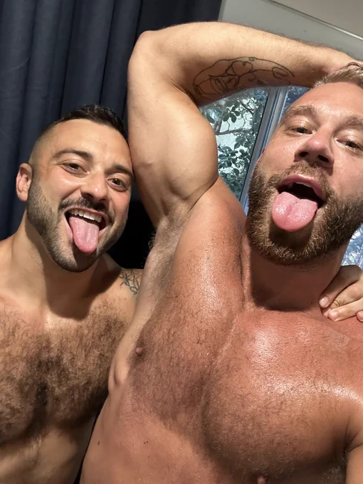 Brogan posing for a selfie with gay male porn actor Drew Valentino