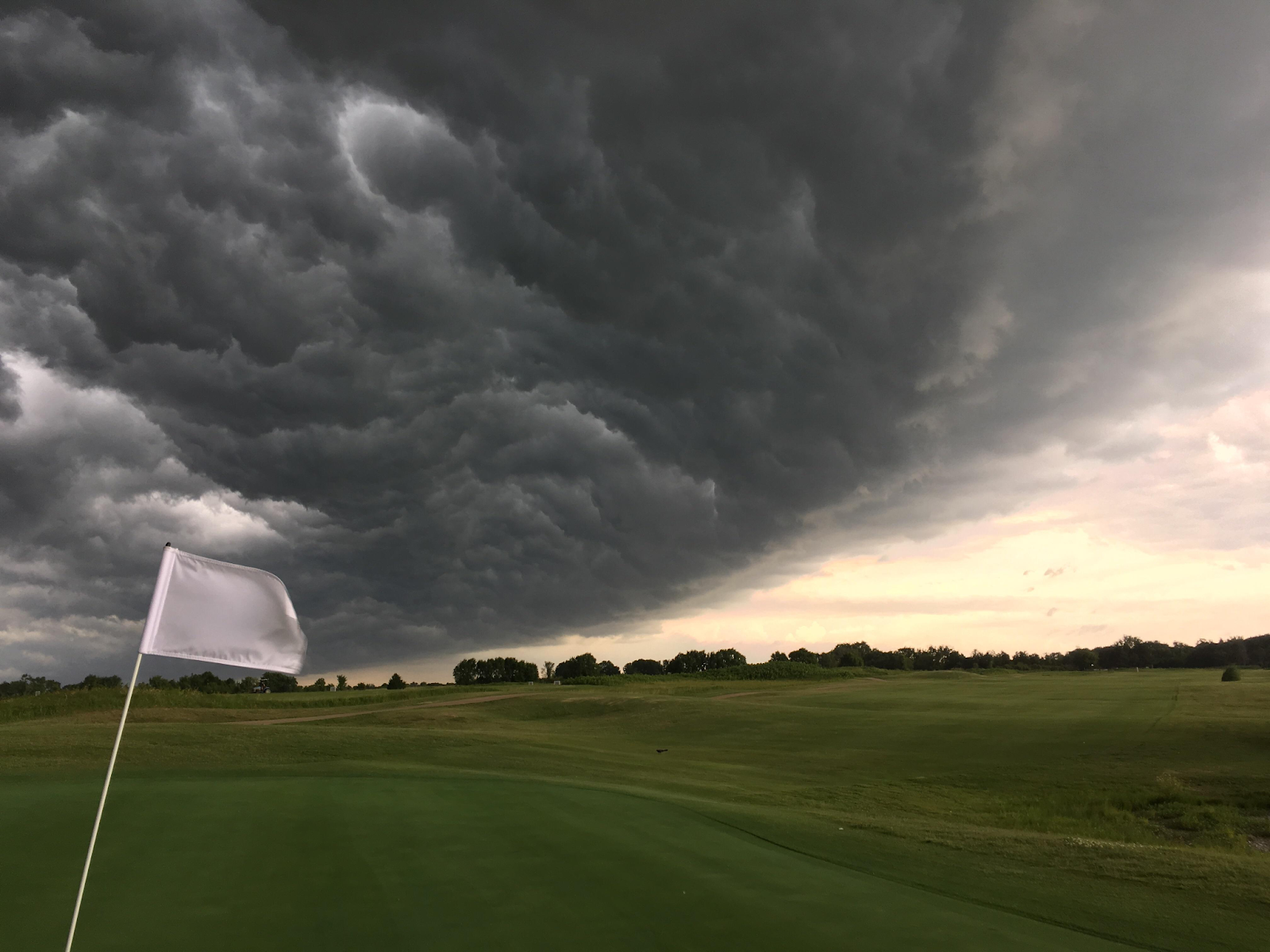 stormy clouds over a golf course