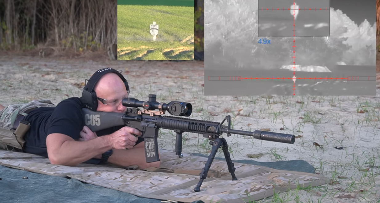 Man laying down target practicing with a Pulsar thermal scope using a rifle bipod