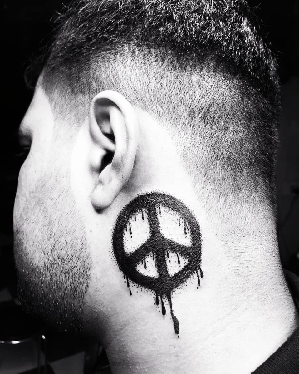 Paint Stroke Peace Tattoo