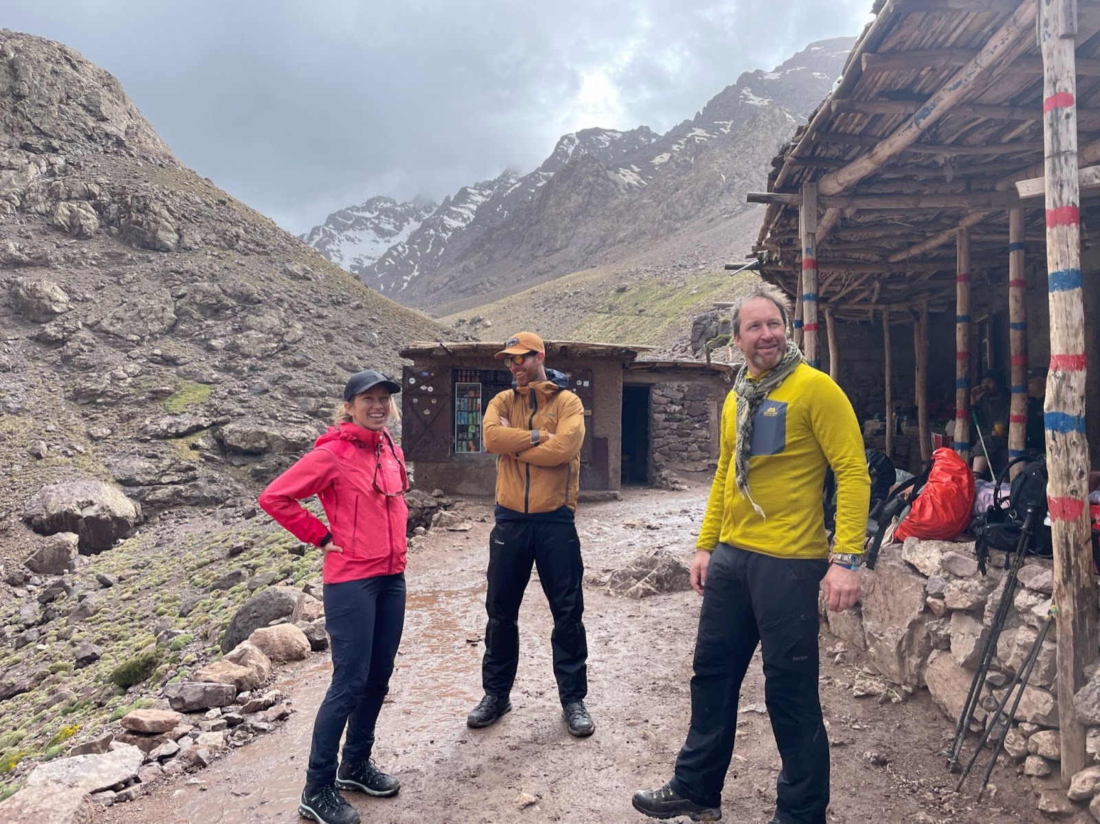 Emer and two fellow hikers resting in wet weather at a tea house on the way up Mount Toubkal.