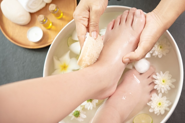 Foot washing in spa before treatment. spa treatment and product for female feet and hand spa.