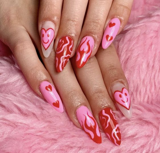 Long acrylic nails with red heart nail art design