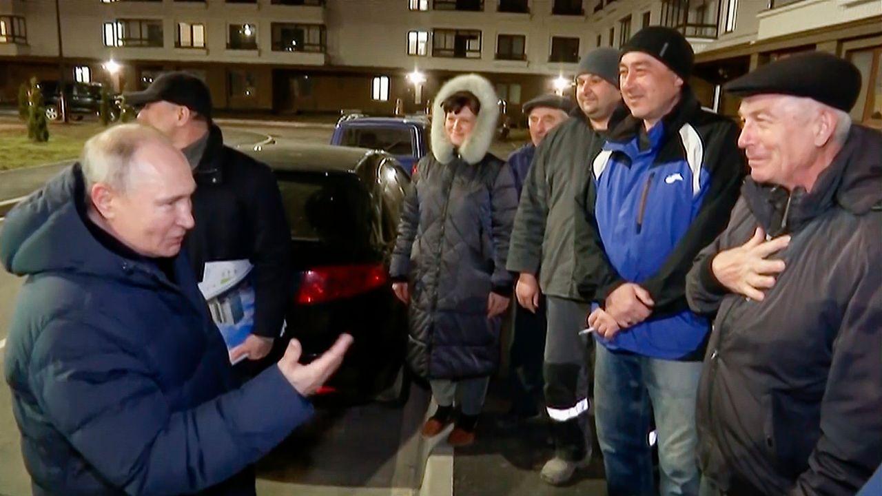 Putin talks with local residents during his visit to Mariupol.