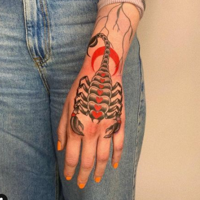 Scorpion tattoo on hand