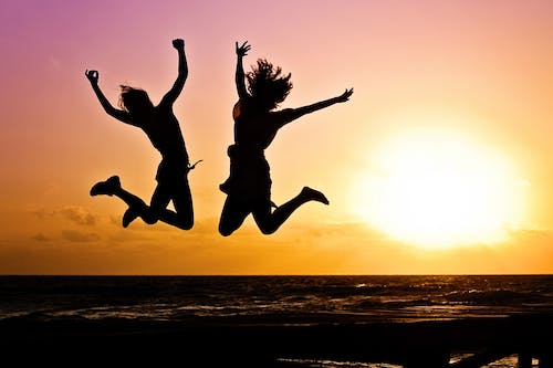 Free  Silhouette Photography Of Jump Shot Of Two Persons  Stock Photo