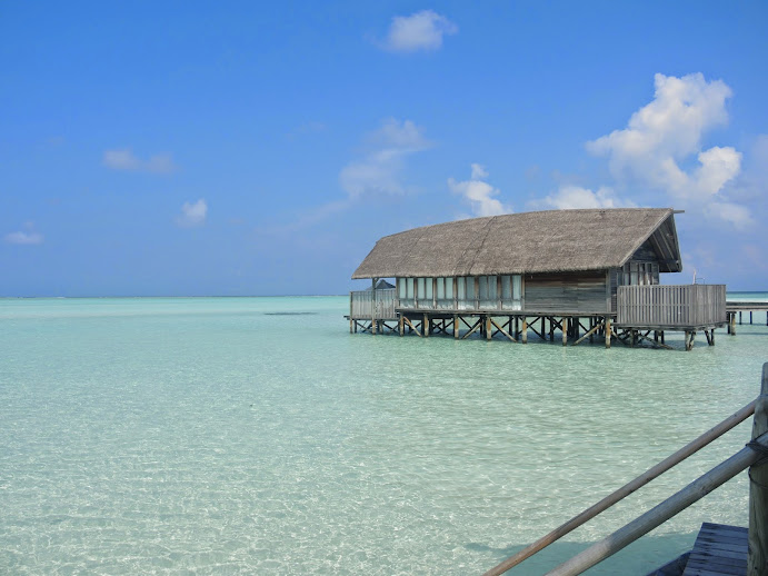 a building on stilts in the water