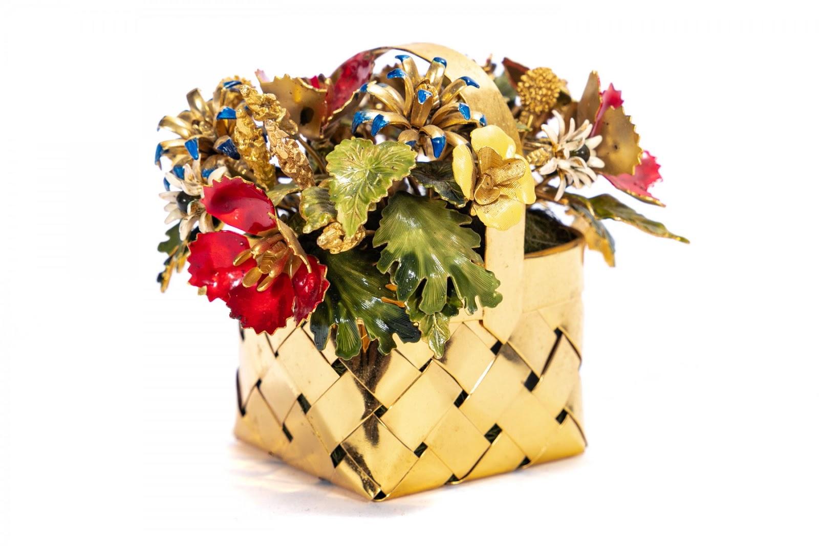 A stunning vintage floral arrangement in a diminutive 22k vermeil sterling silver basket.