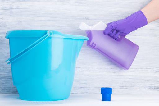Step 1 to unshrink a t-shirt: fill the bucket with conditioner and a quart of water.