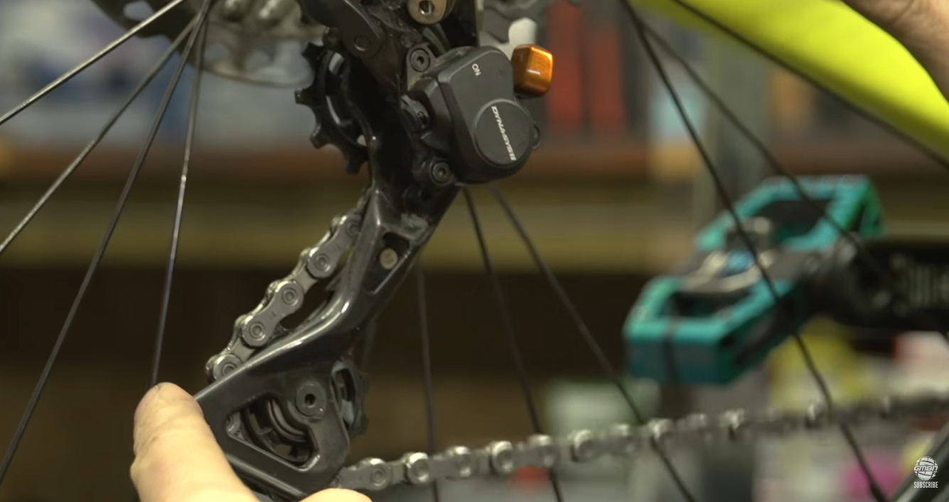 To make it easier to remove a chain on a mountain bike and replace it, disengage the clutch mechanism. 