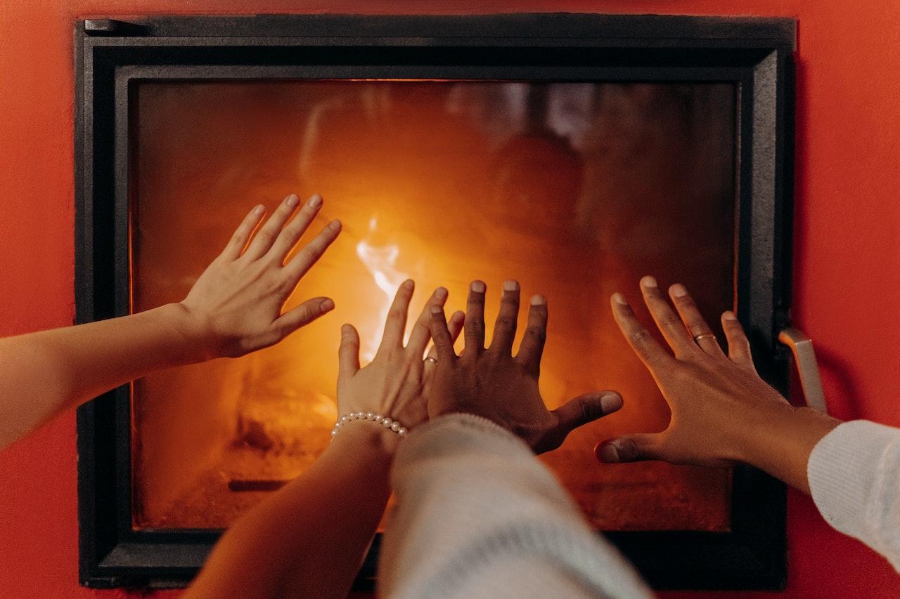 People warming their hands