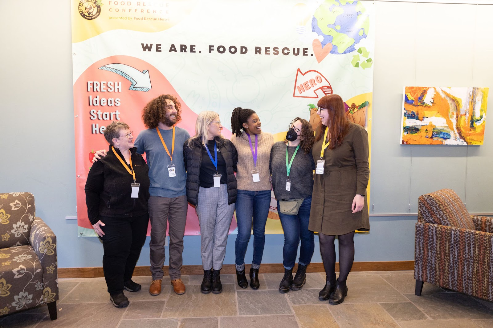 Food Rescue Conference Attendees in front of a Banner