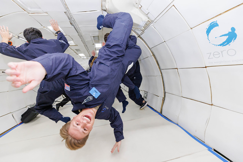US Space Force cadet floats upside down in zero gravity while photographer Steve Boxall capture the turn.