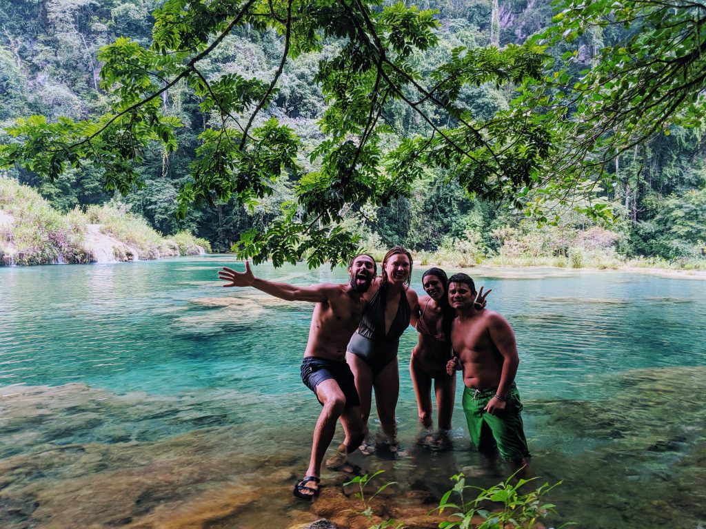 Cassey celebrating with friends in a river during keto boot camp