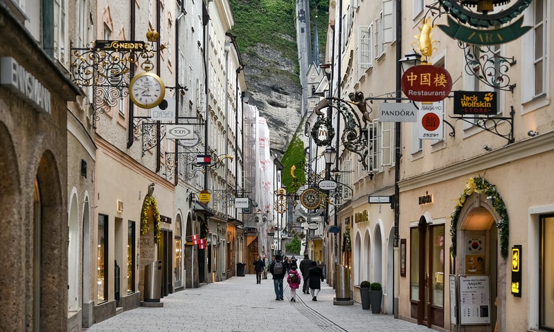 People walking along a pedestrian street in Salzburg