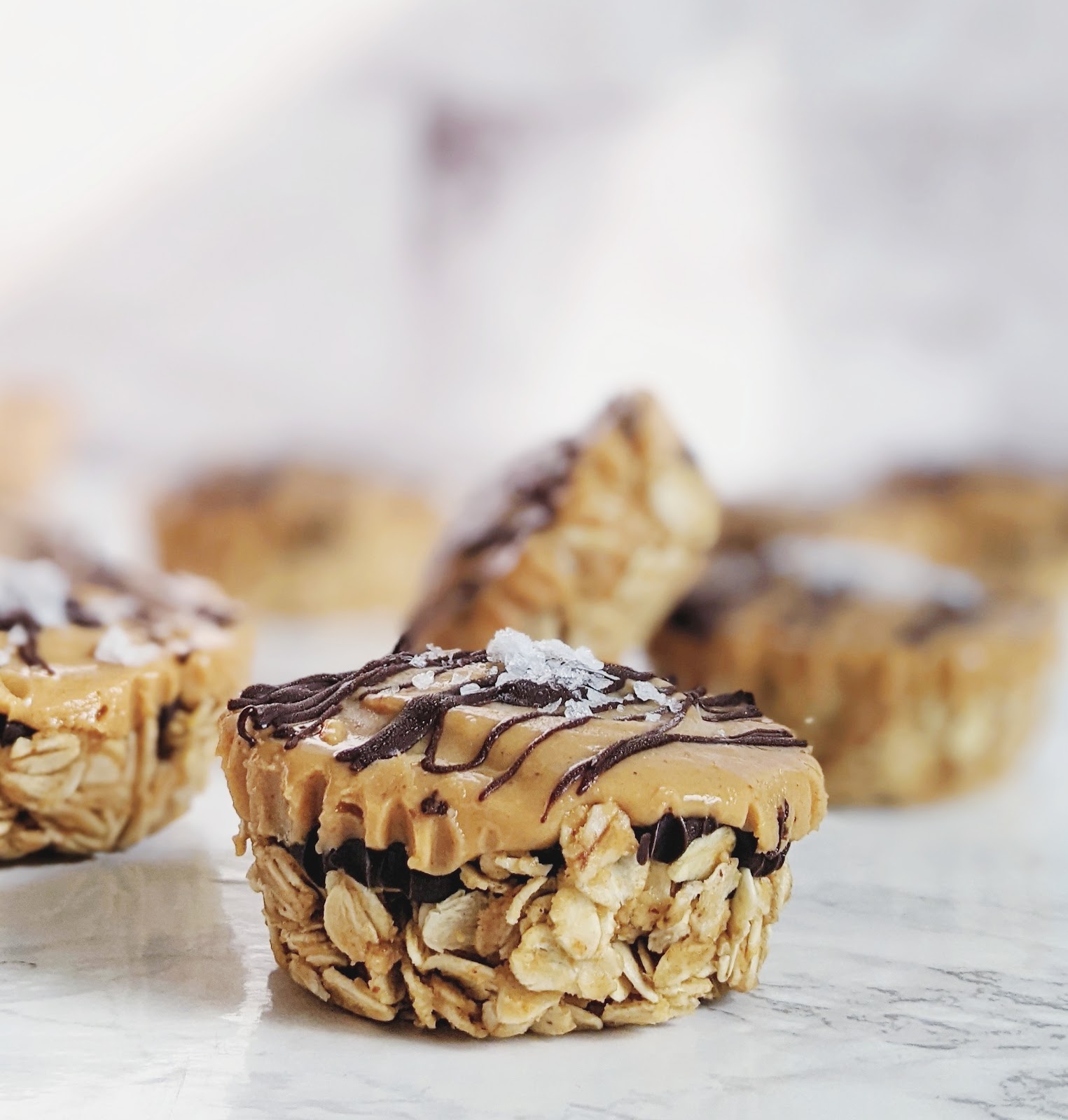 close up of peanut butter cup topped with flaky sea salt