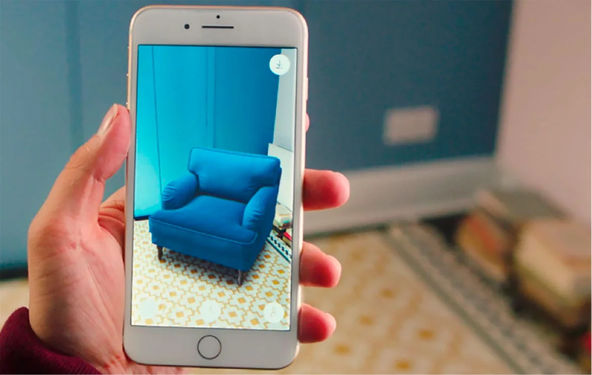 What is metaverse article shows how a person uses his/hers device to portray how a sofa looks like inside the living room.