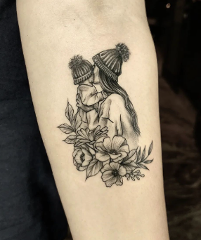 Flower With Mom And Child Tattoo Honoring Parents