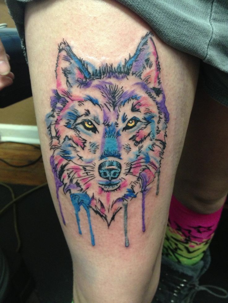 wolf watercolor tattoo on thigh leg for woman
