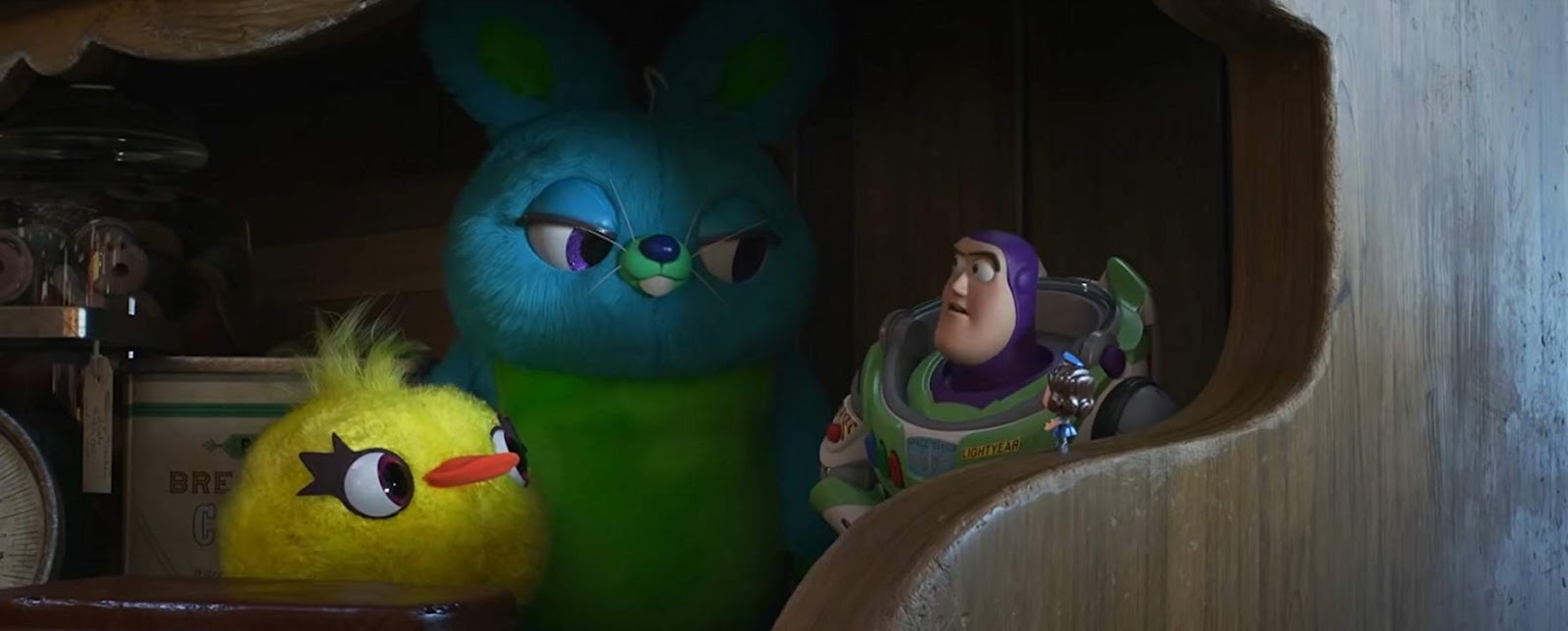 Movie still of Toy Story 4 showing Ducky, Bunny, and Buzz Lightyear played by Jordan Peele, Keegen-Michael Key, and Tim Allen