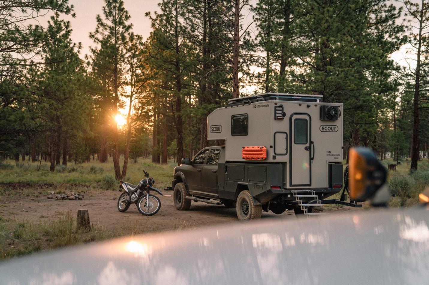An off road park for camping with an overlander and dirt bike