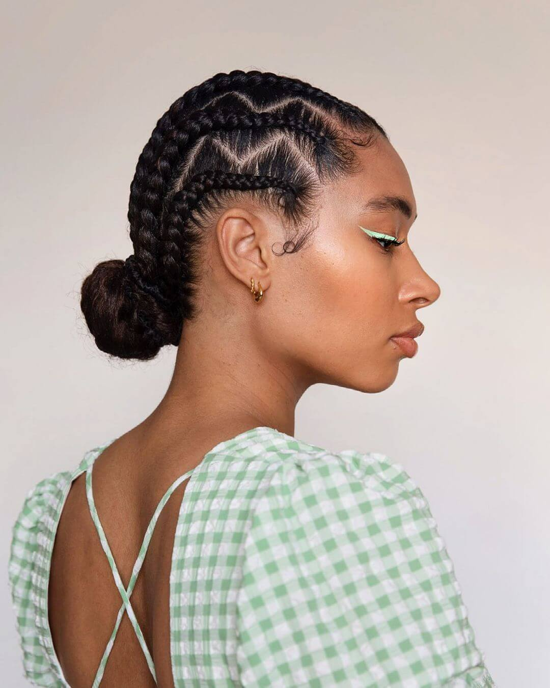 Get an elegant look with the braided side bun
