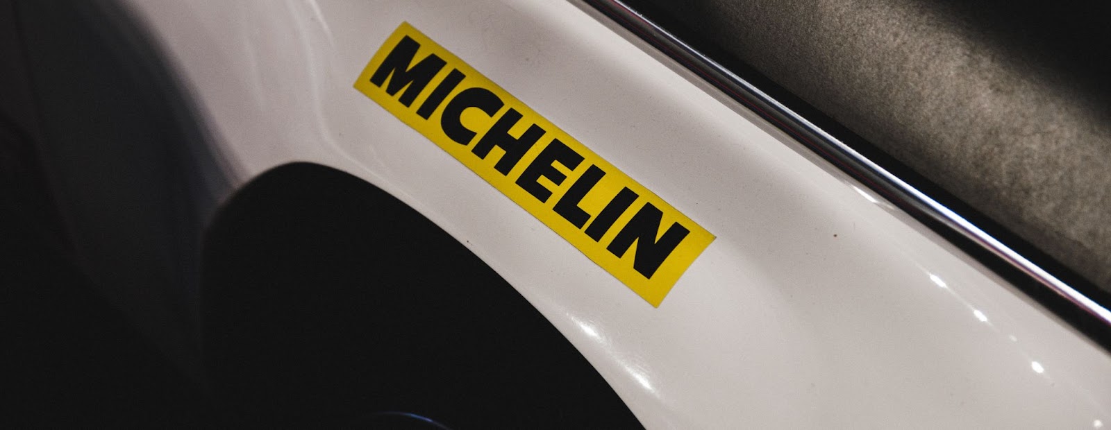 A close-up picture of the Michelin tire brand logo